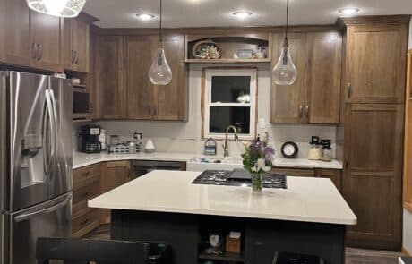 Custom white granite countertop with black drawers and cabinets