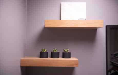 Custom wooden floating shelves for office space