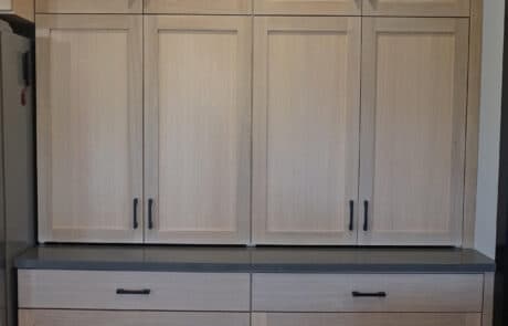 Custom wood kitchen cabinets and drawers with black granite counter top