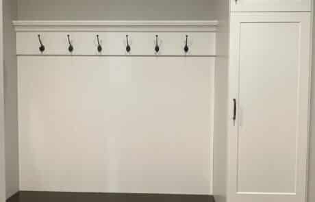 Custom mudroom cabinets and coat hangers